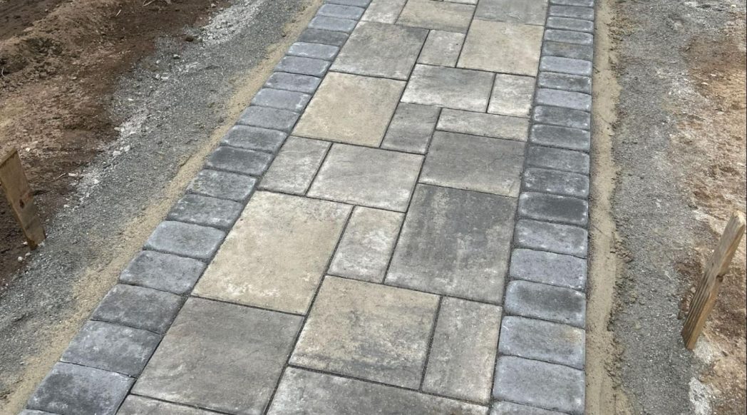 Clean paver patio in an Andover MA backyard ready for winter
